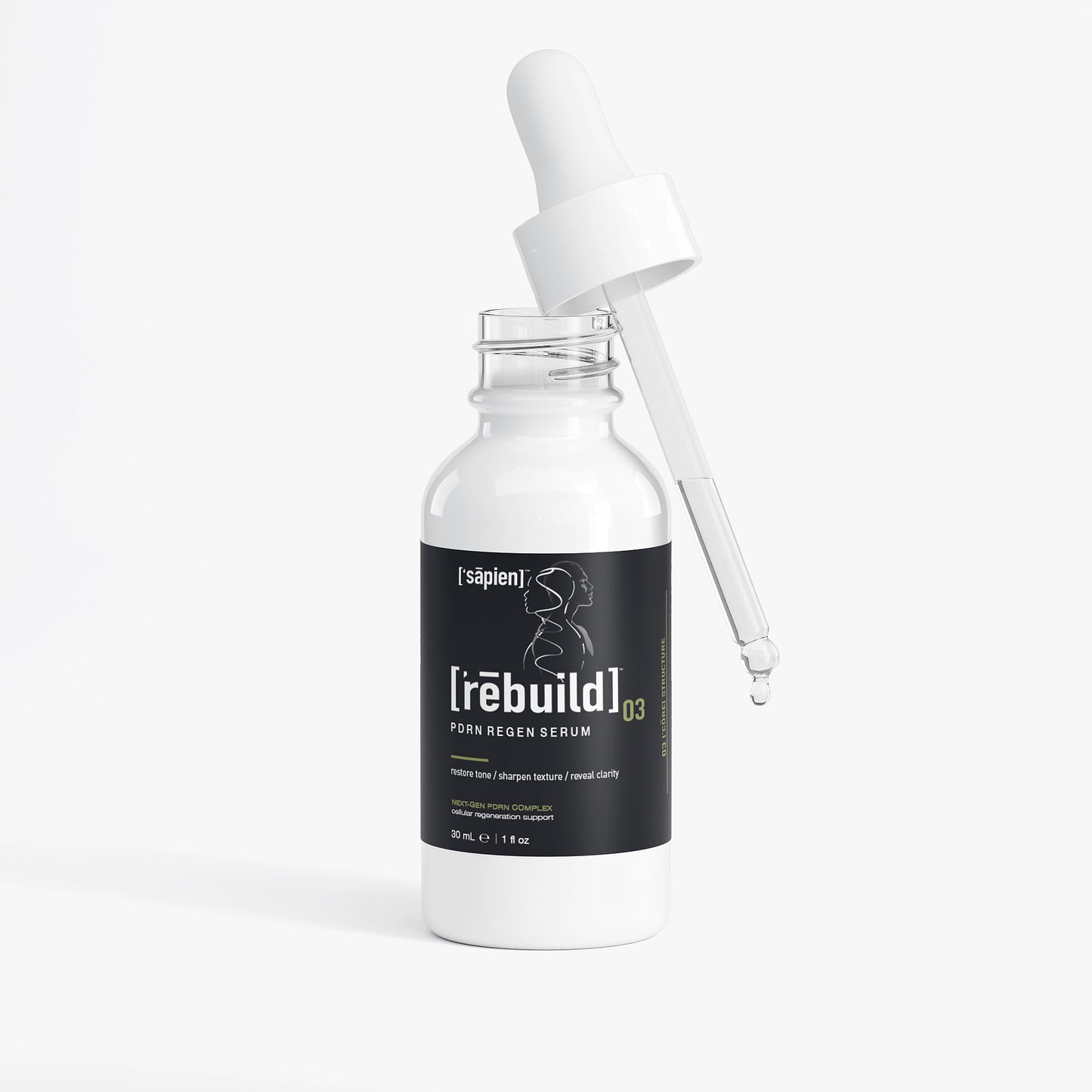 Skincare serum bottle with dropper labeled 'rebuild' on a white background